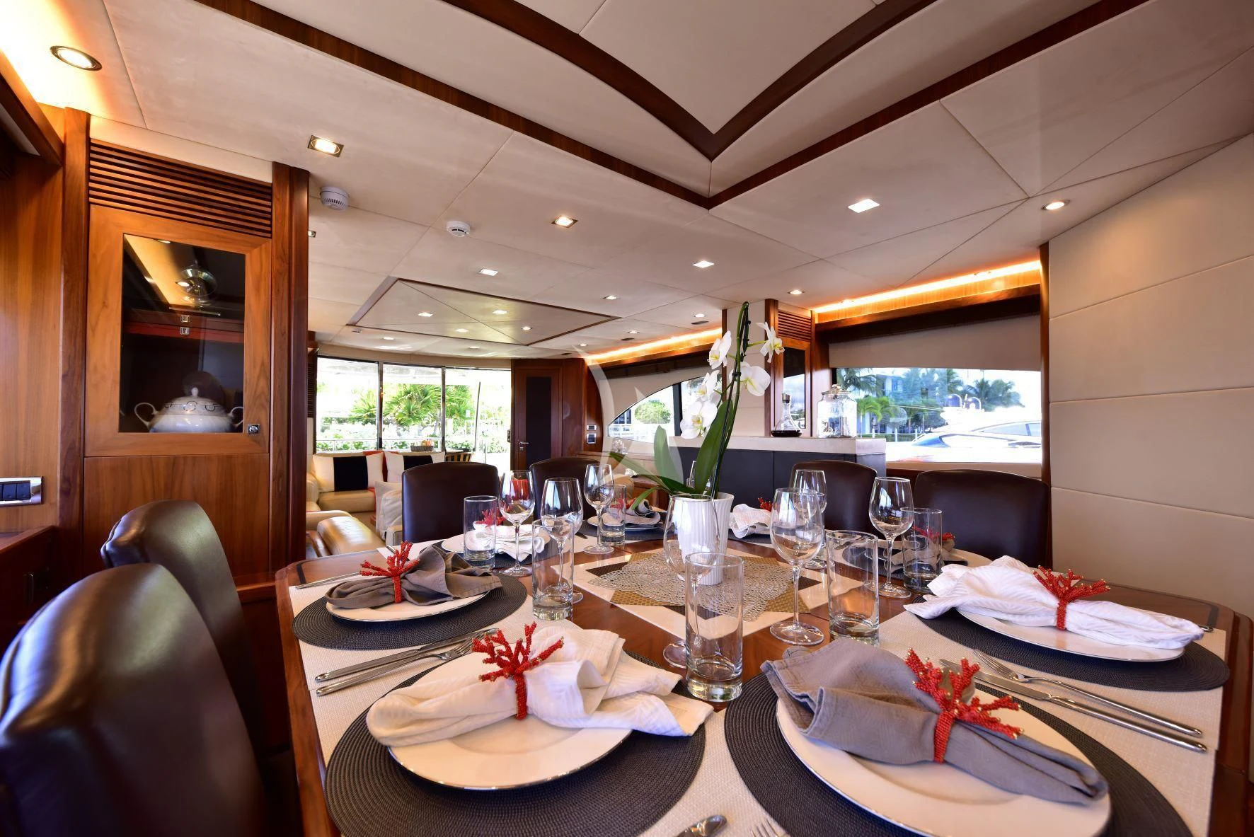 a table set with place settings aboard CATALANA Yacht for Charter