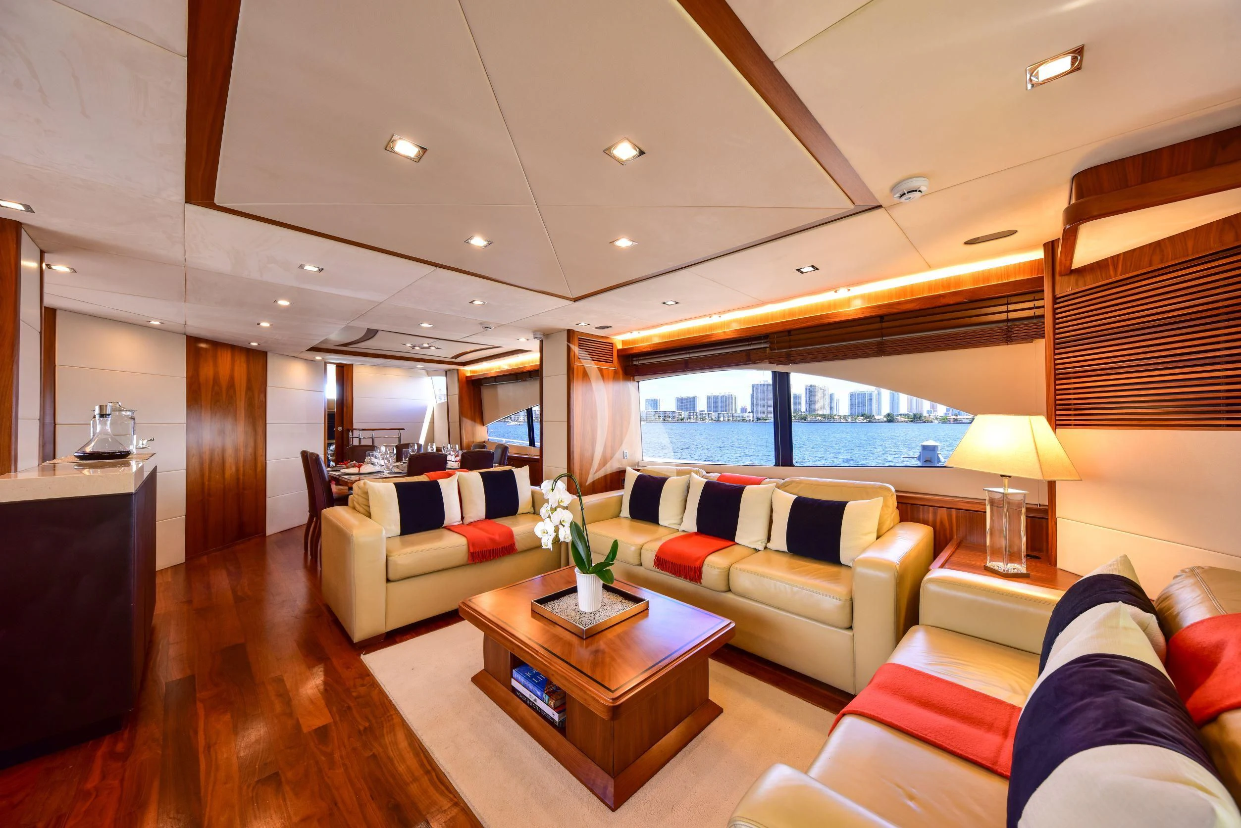 a living room with a large window aboard CATALANA Yacht for Charter