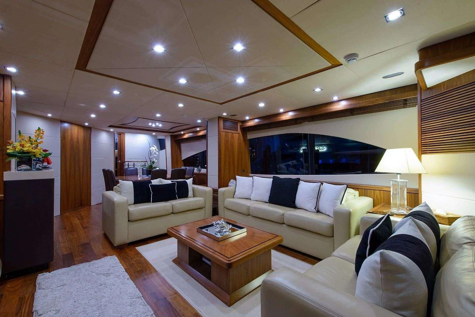 a living room with a couch and a coffee table aboard CATALANA Yacht for Charter