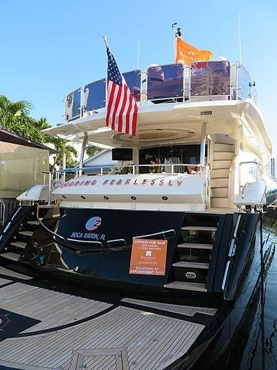 a boat with a flag on the front aboard CATALANA Yacht for Charter