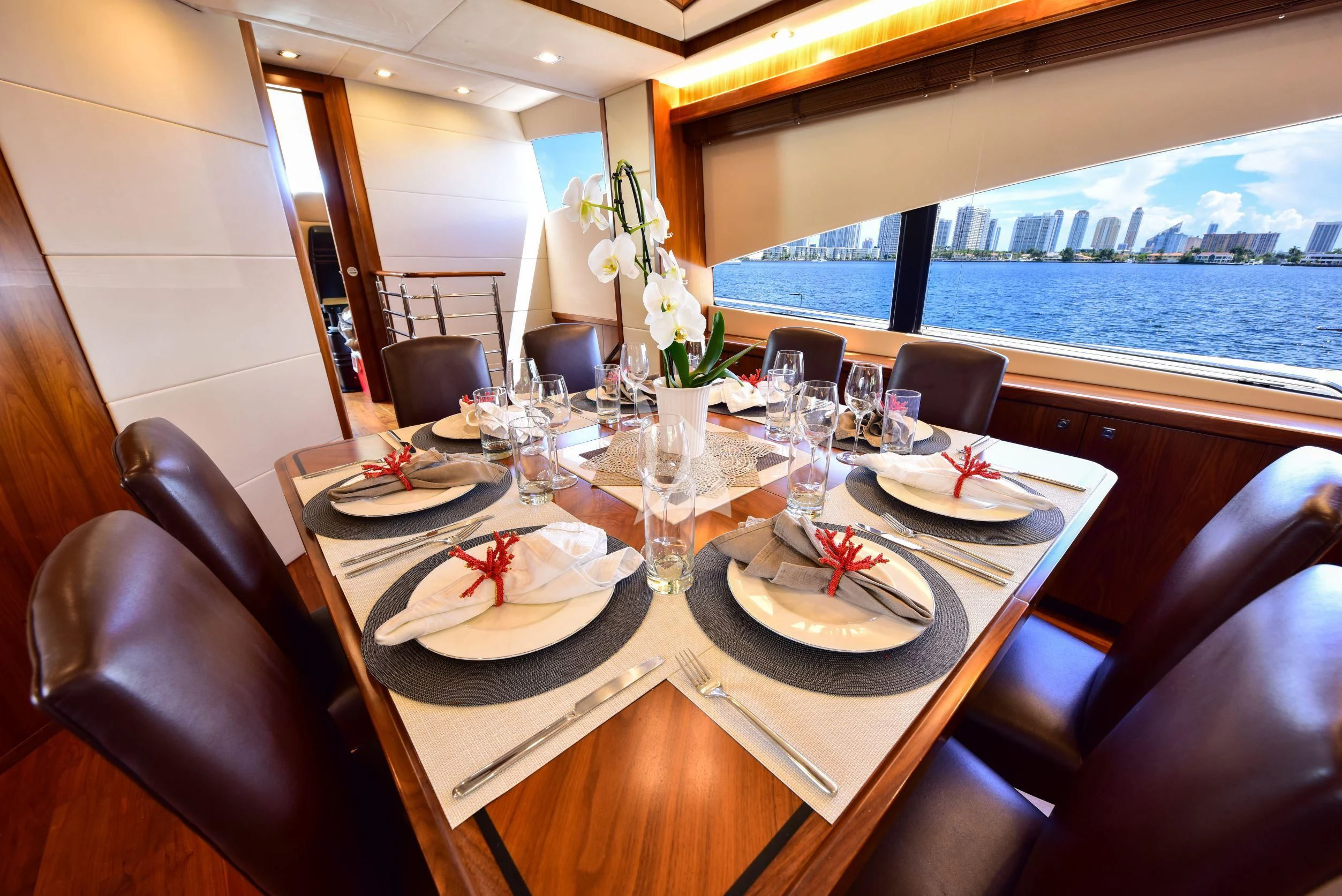 a table with plates and silverware aboard CATALANA Yacht for Charter