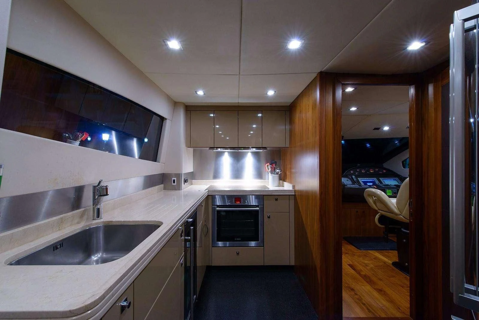 a kitchen with a sink and a couch aboard CATALANA Yacht for Charter