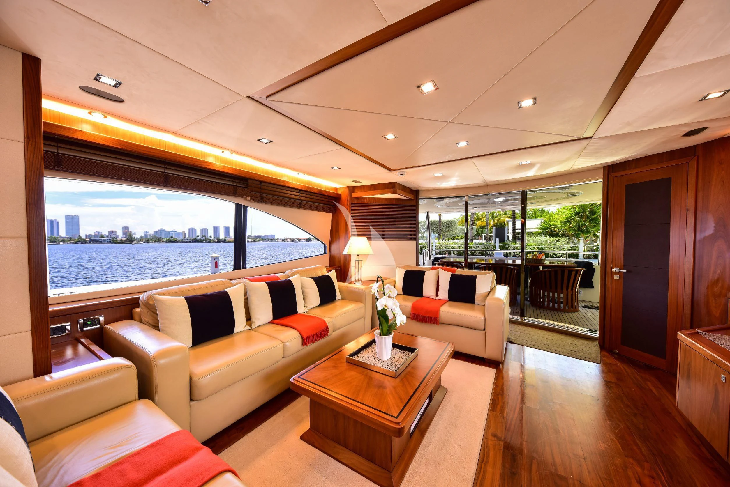 a living room with a large window aboard CATALANA Yacht for Charter