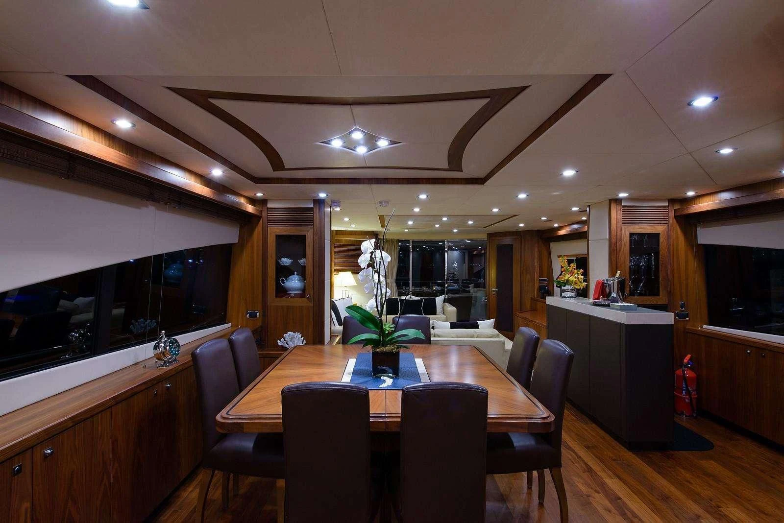 a large kitchen with a table and chairs aboard CATALANA Yacht for Charter