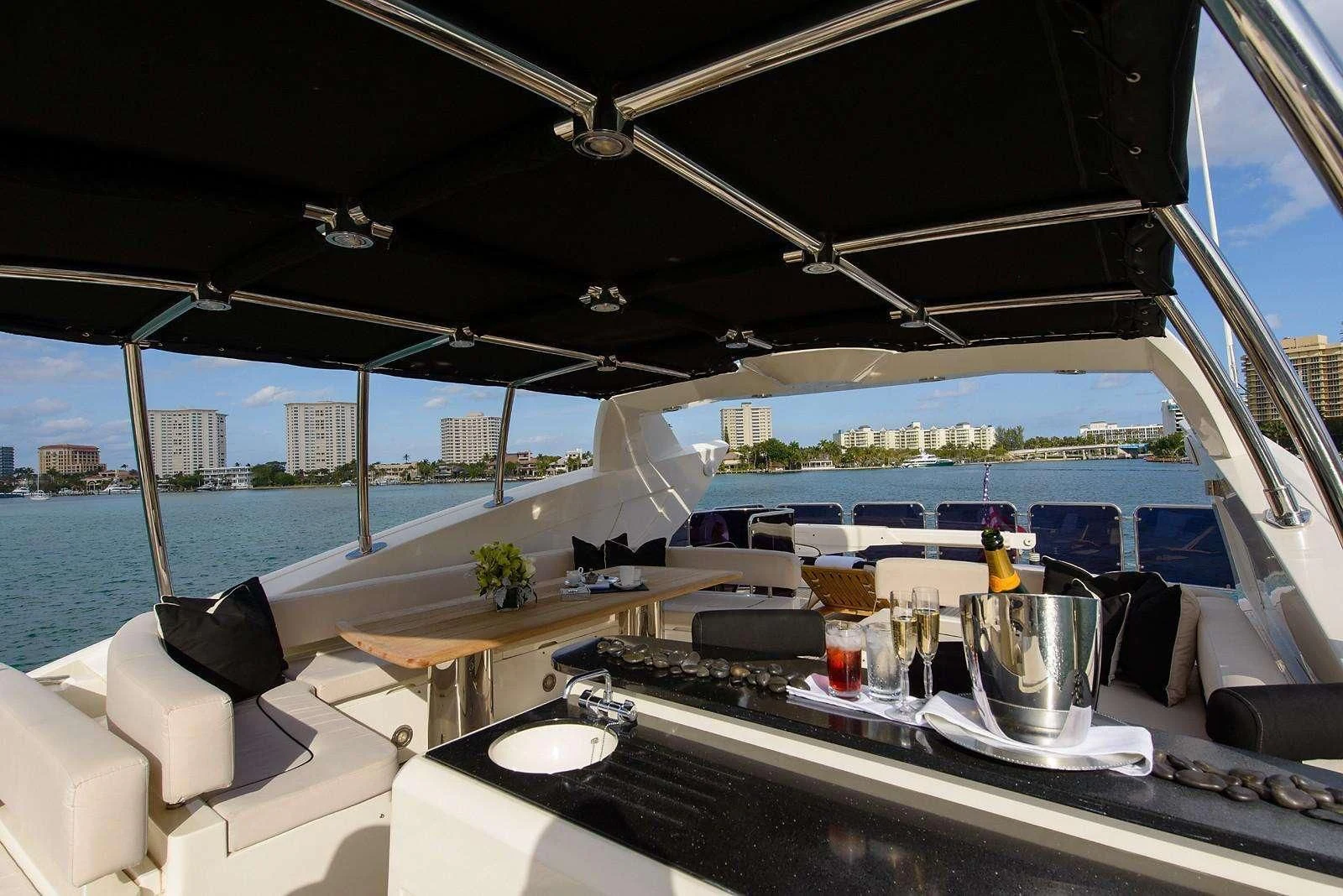 a room with a view of the water and a city aboard CATALANA Yacht for Charter
