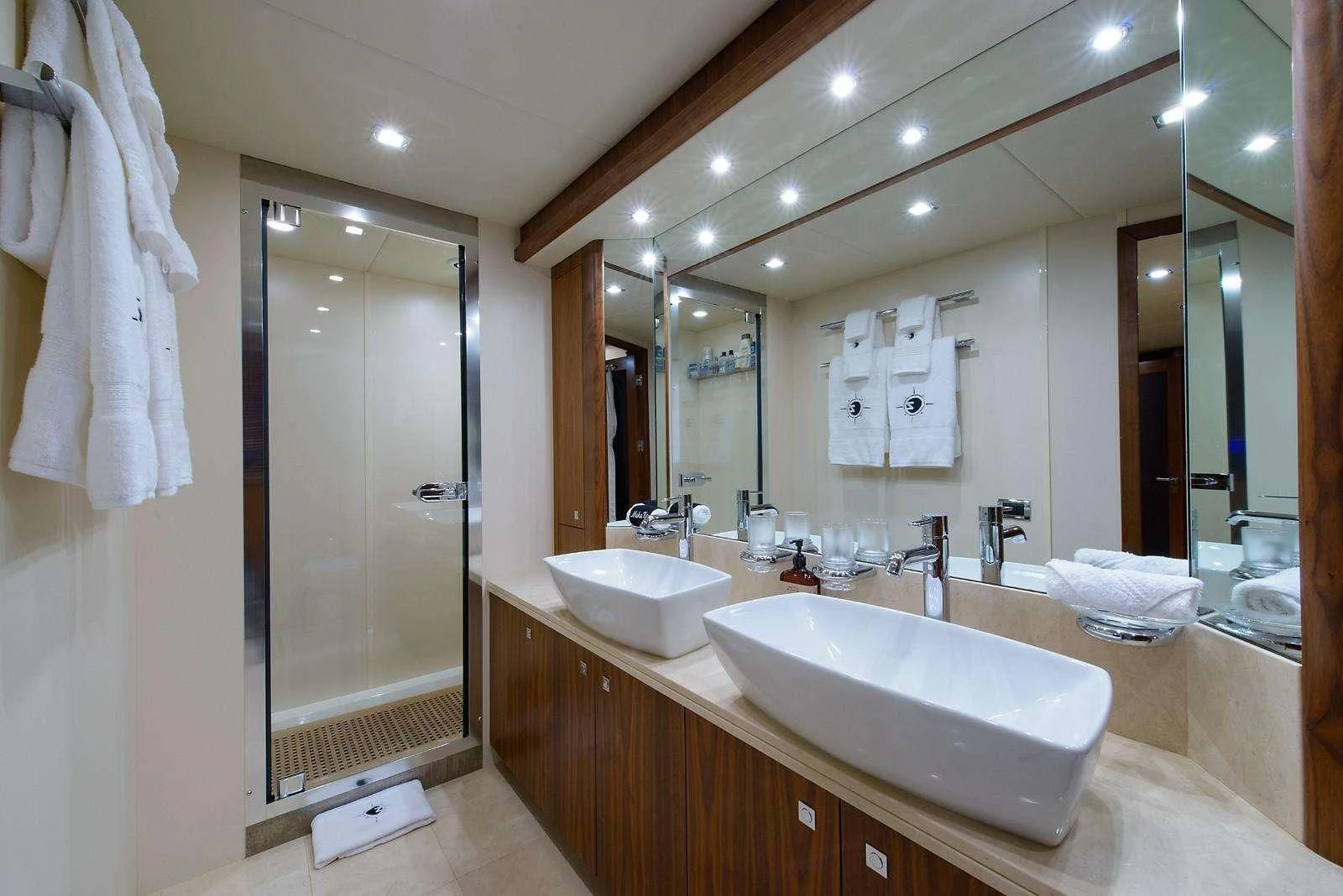 a bathroom with a large mirror aboard CATALANA Yacht for Charter