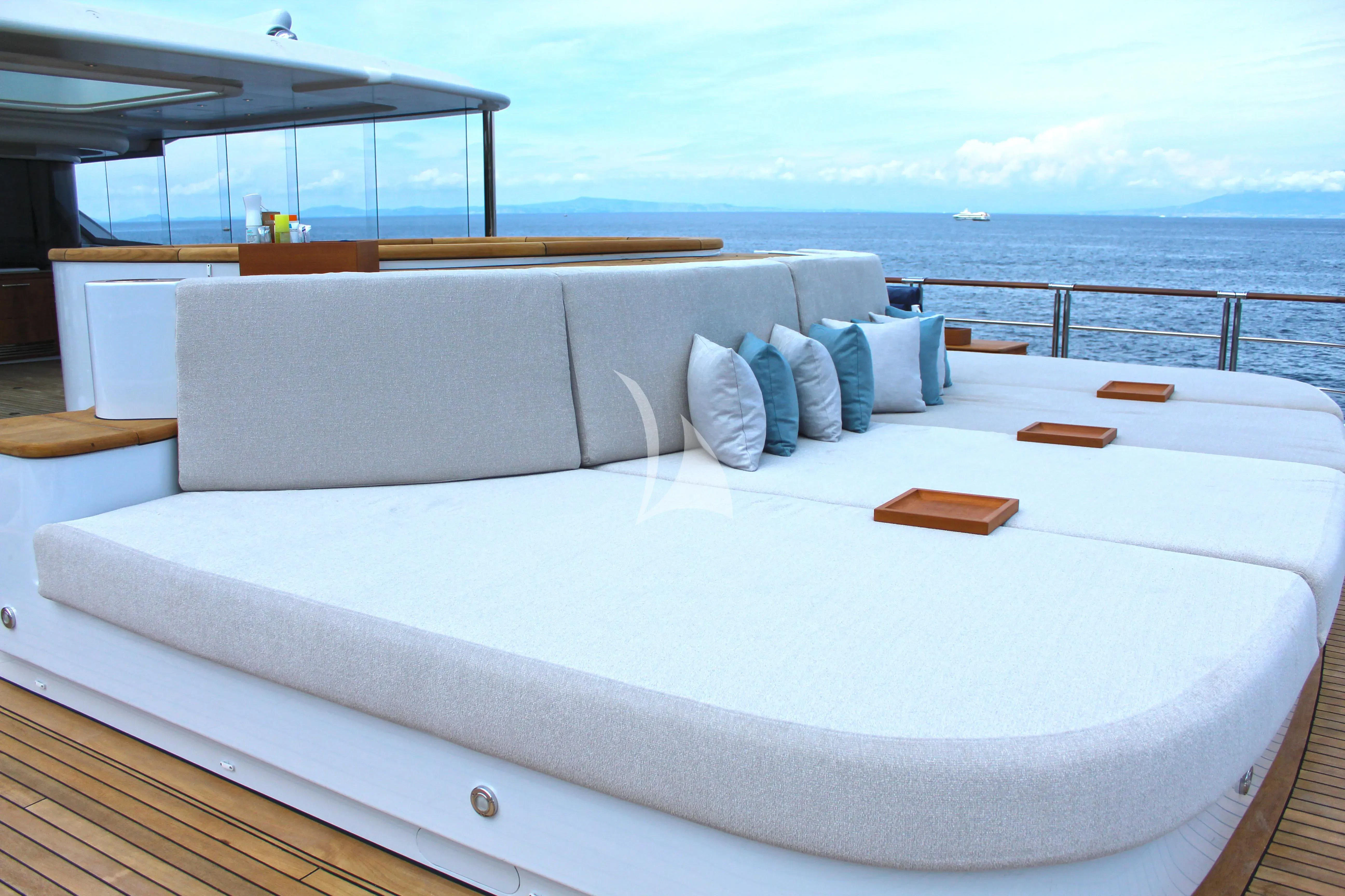a bed on a balcony aboard WHEELS Yacht for Sale