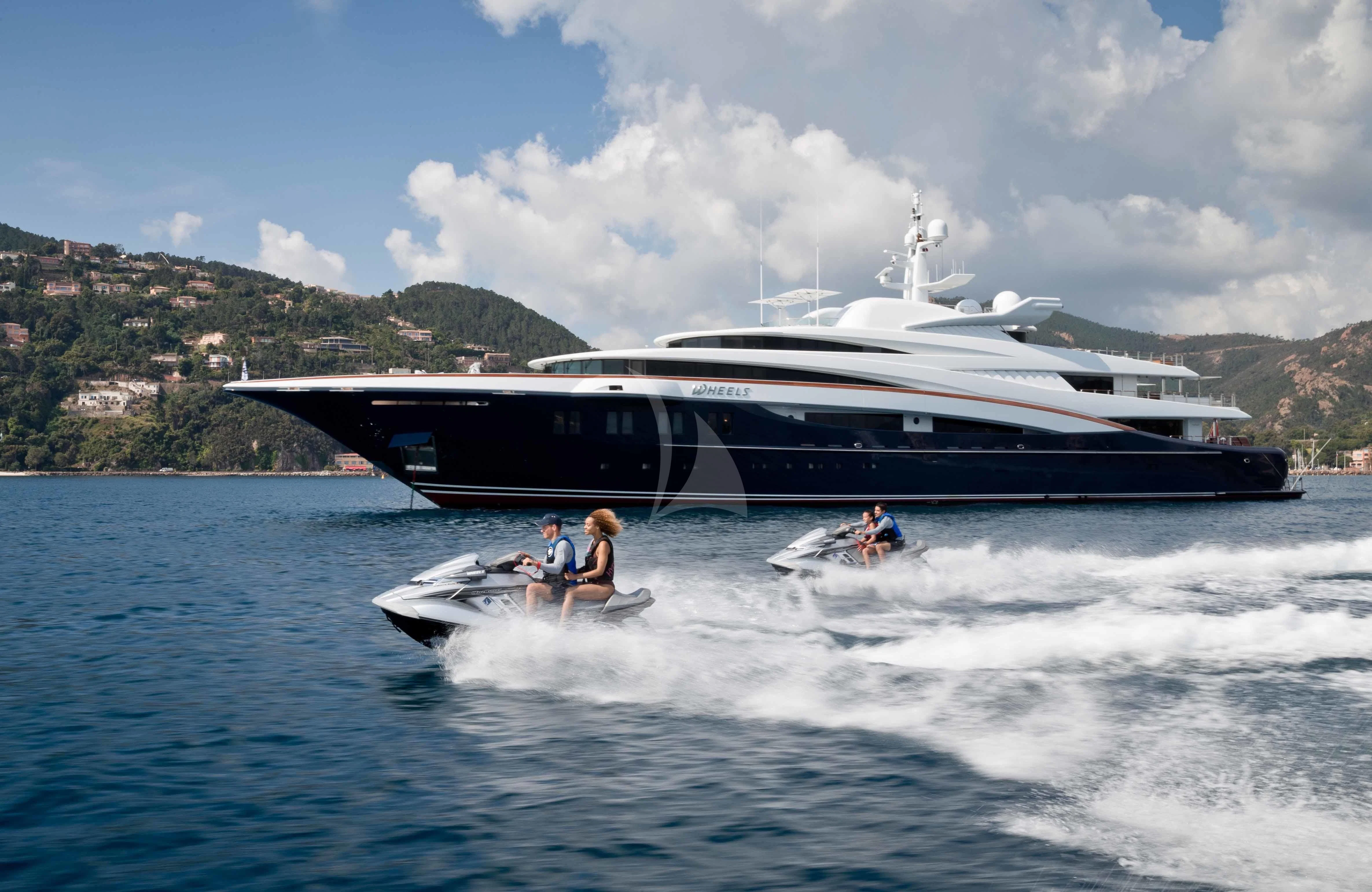 a boat with people on it aboard WHEELS Yacht for Sale