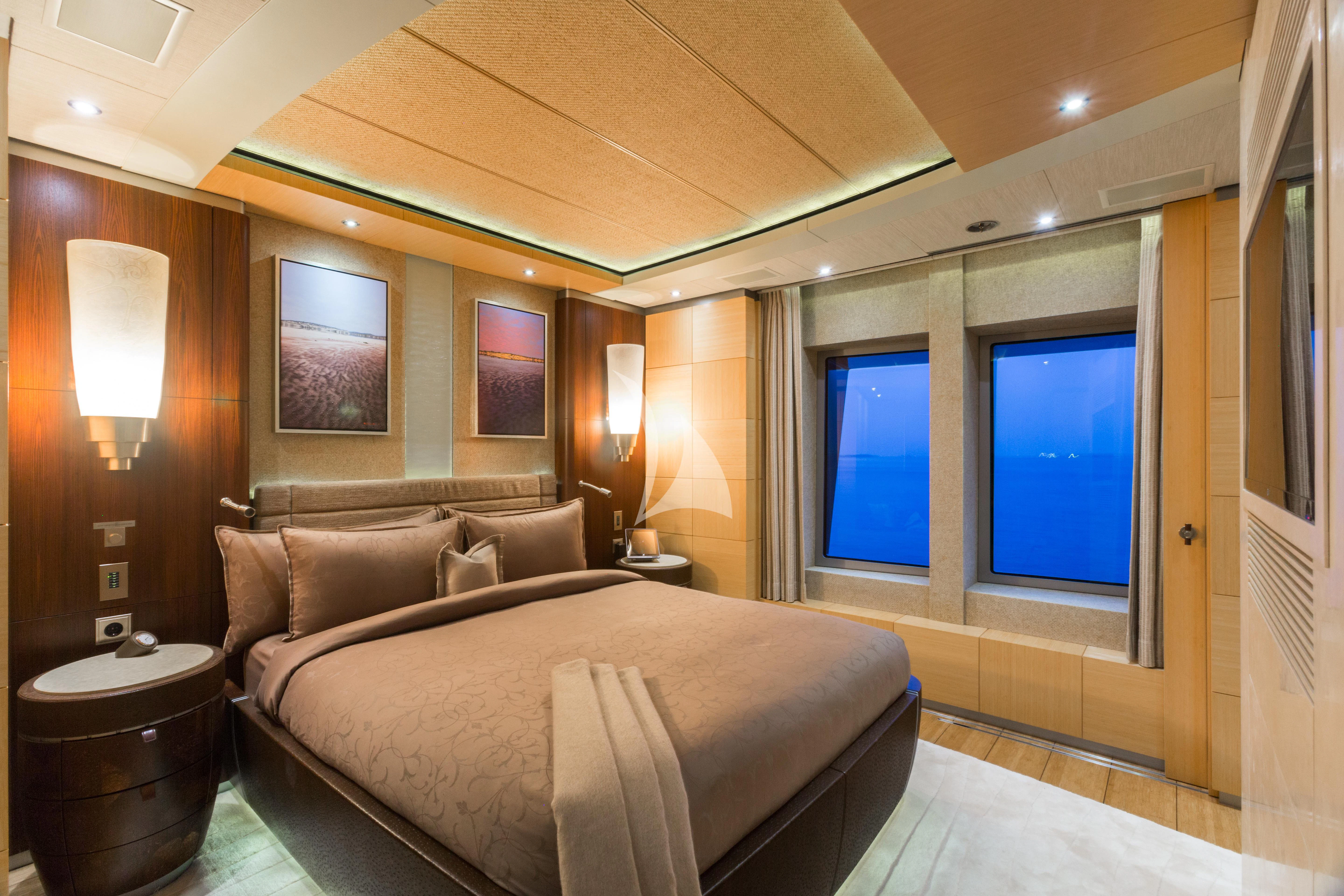a large bed in a hotel room aboard WHEELS Yacht for Sale