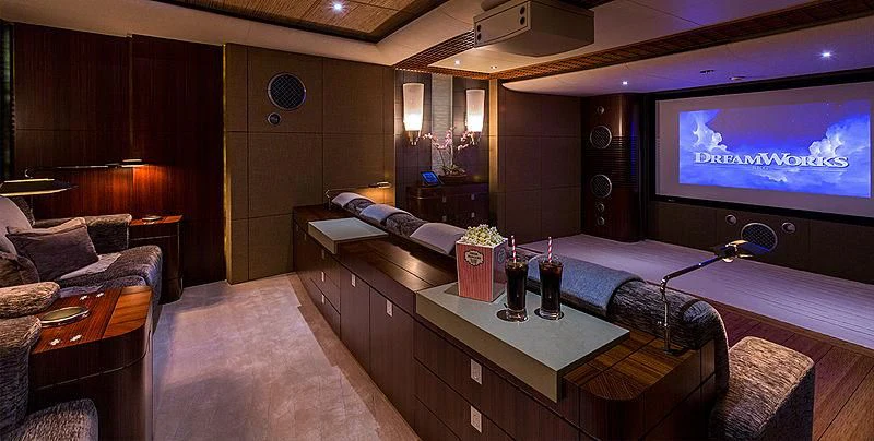 a room with a bed and a television aboard WHEELS Yacht for Sale