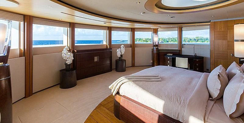 a large bedroom with a large bed aboard WHEELS Yacht for Sale