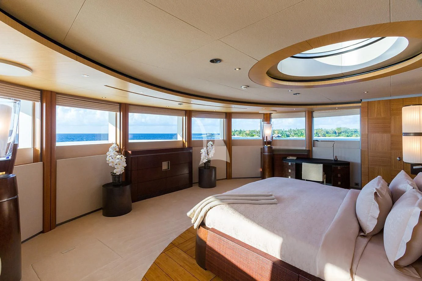 a large bedroom with a large bed aboard WHEELS Yacht for Sale
