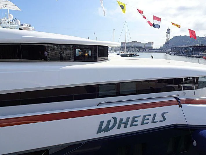 a white and red train aboard WHEELS Yacht for Sale