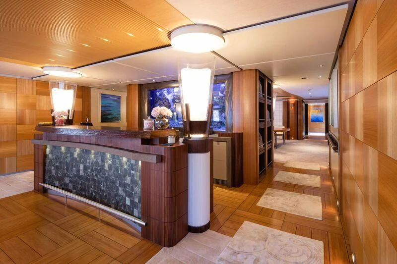 a large kitchen with a bar aboard WHEELS Yacht for Sale