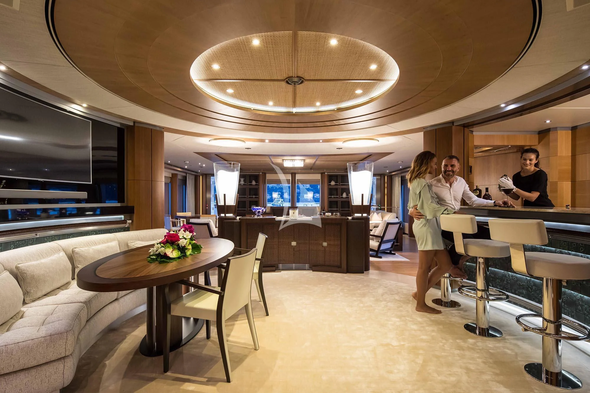 a group of people in a room aboard WHEELS Yacht for Sale