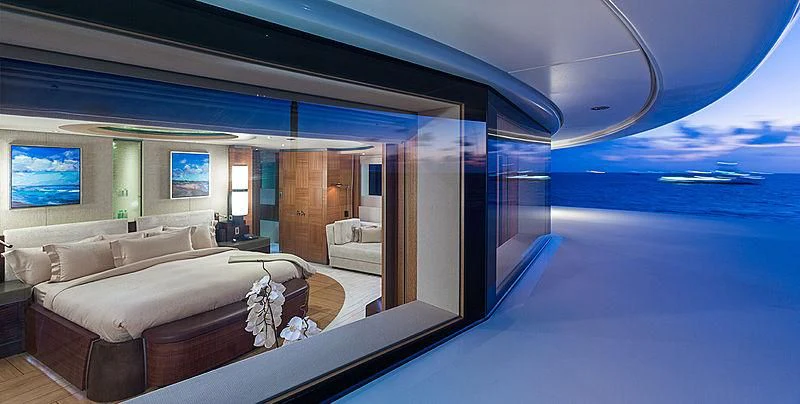 a room with a bed and a table aboard WHEELS Yacht for Sale