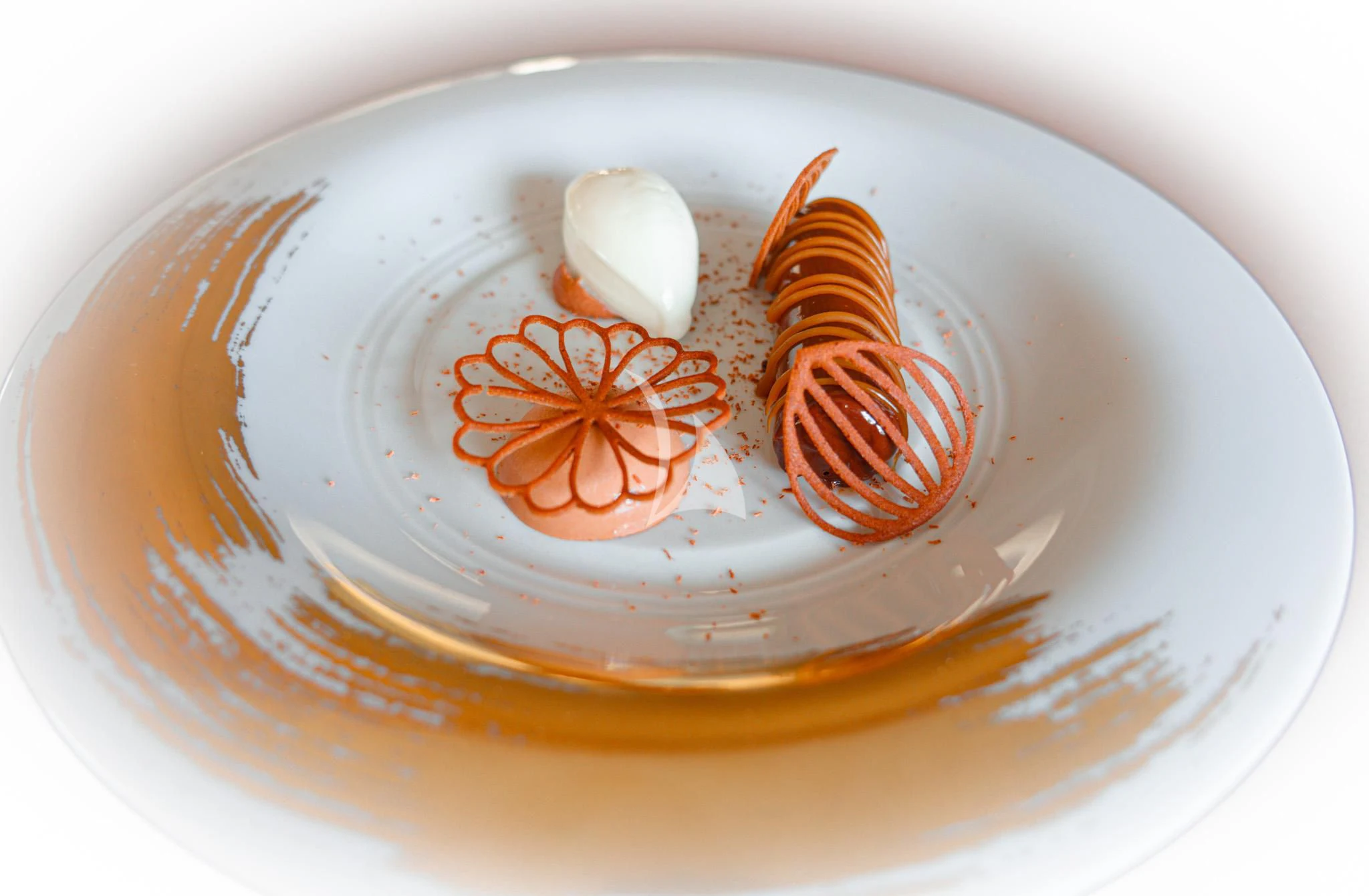 a plate with a red and white design on it aboard WHEELS Yacht for Sale