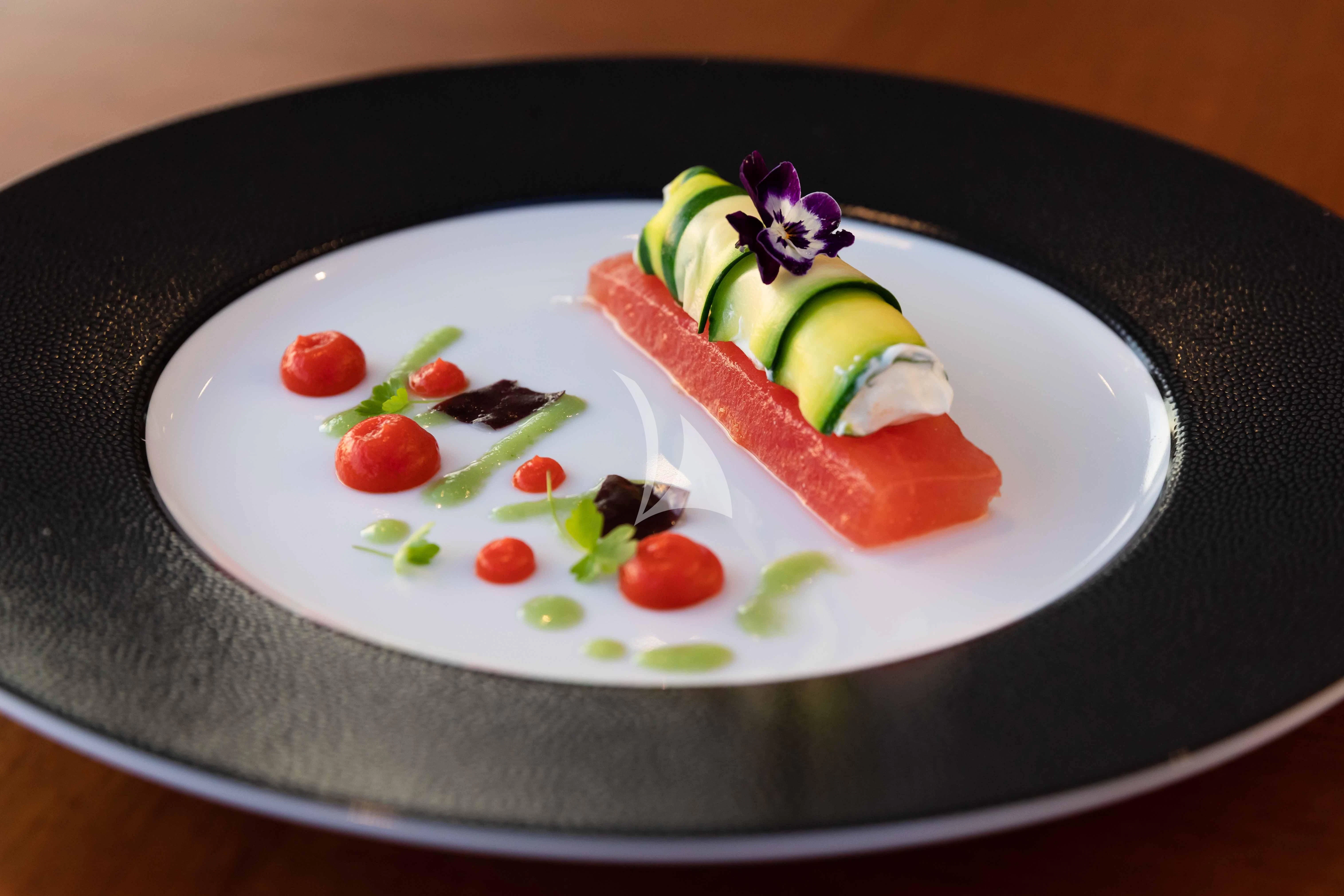 a plate of food aboard WHEELS Yacht for Sale