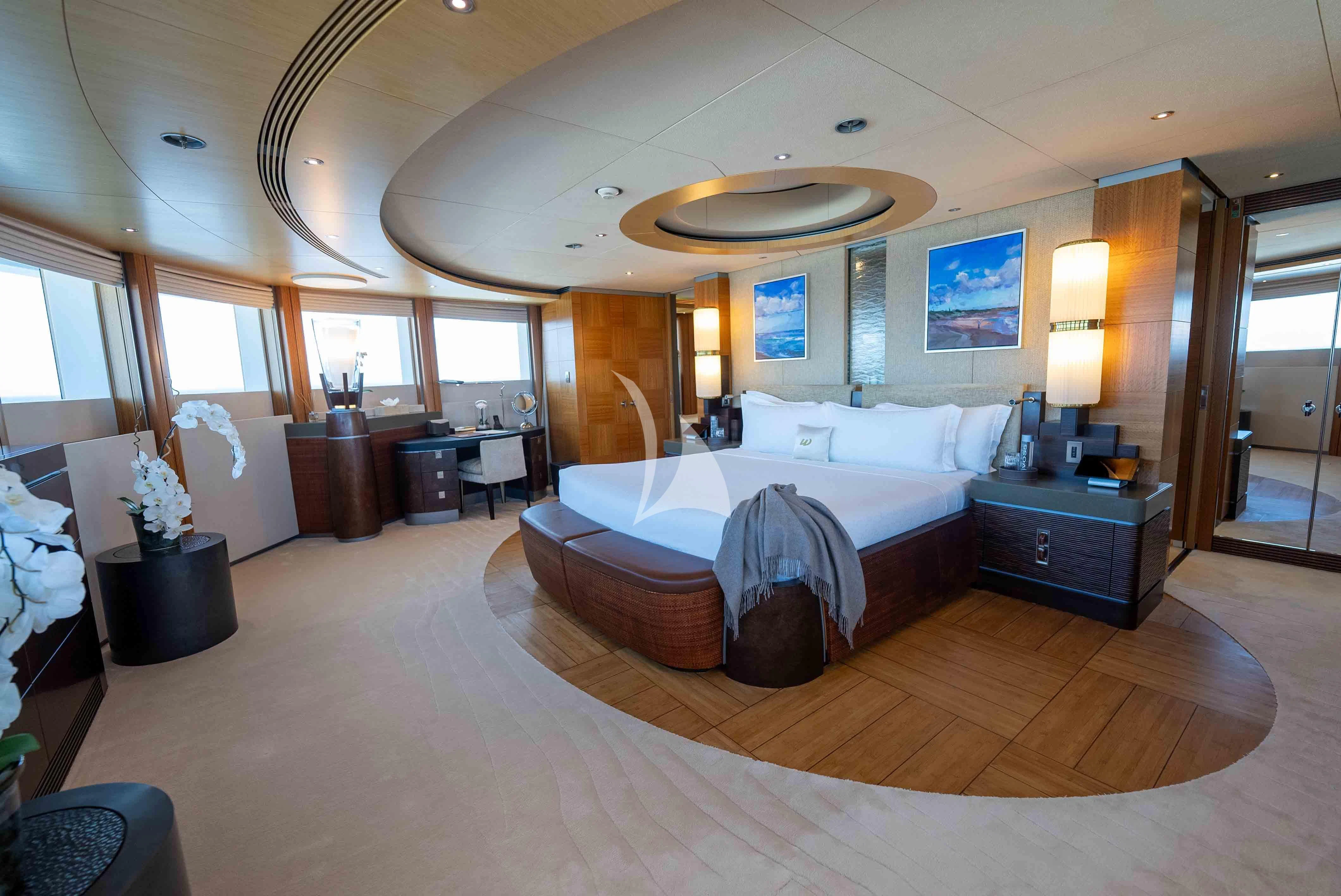 a large hotel room with a large bed and a large window aboard WHEELS Yacht for Sale
