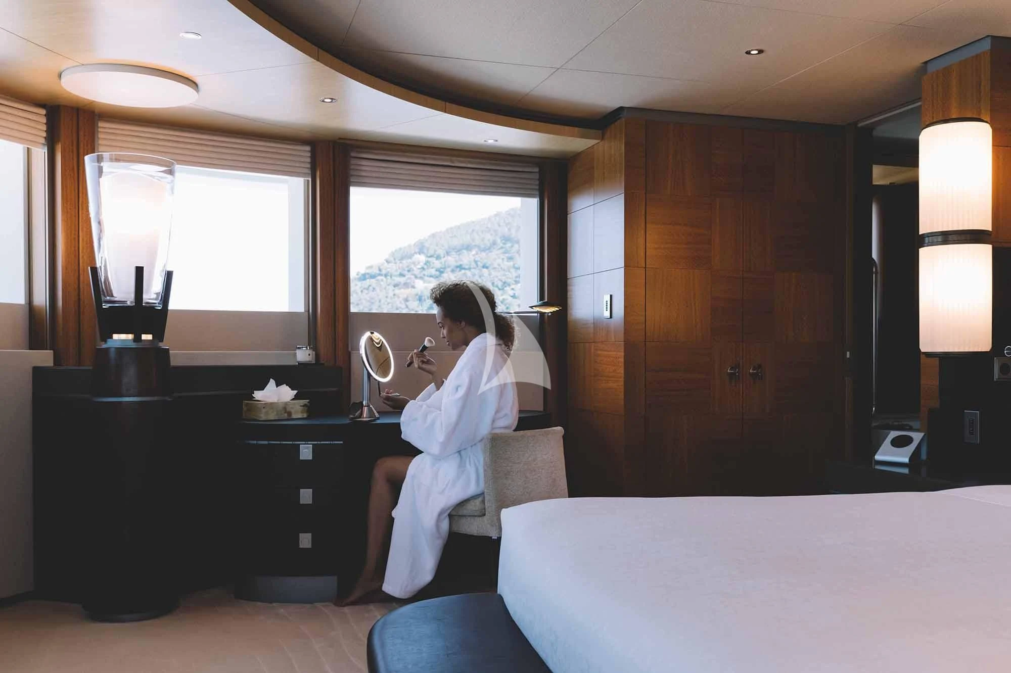 a person sitting on a couch aboard WHEELS Yacht for Sale