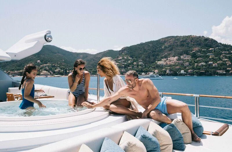 a group of people on a boat aboard WHEELS Yacht for Sale