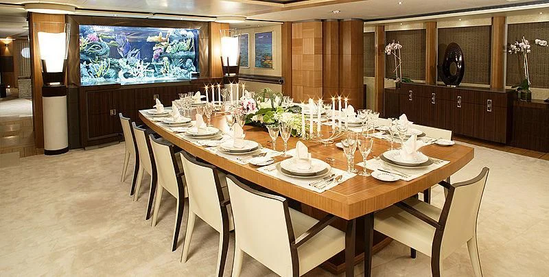 a dining table set for a dinner aboard WHEELS Yacht for Sale