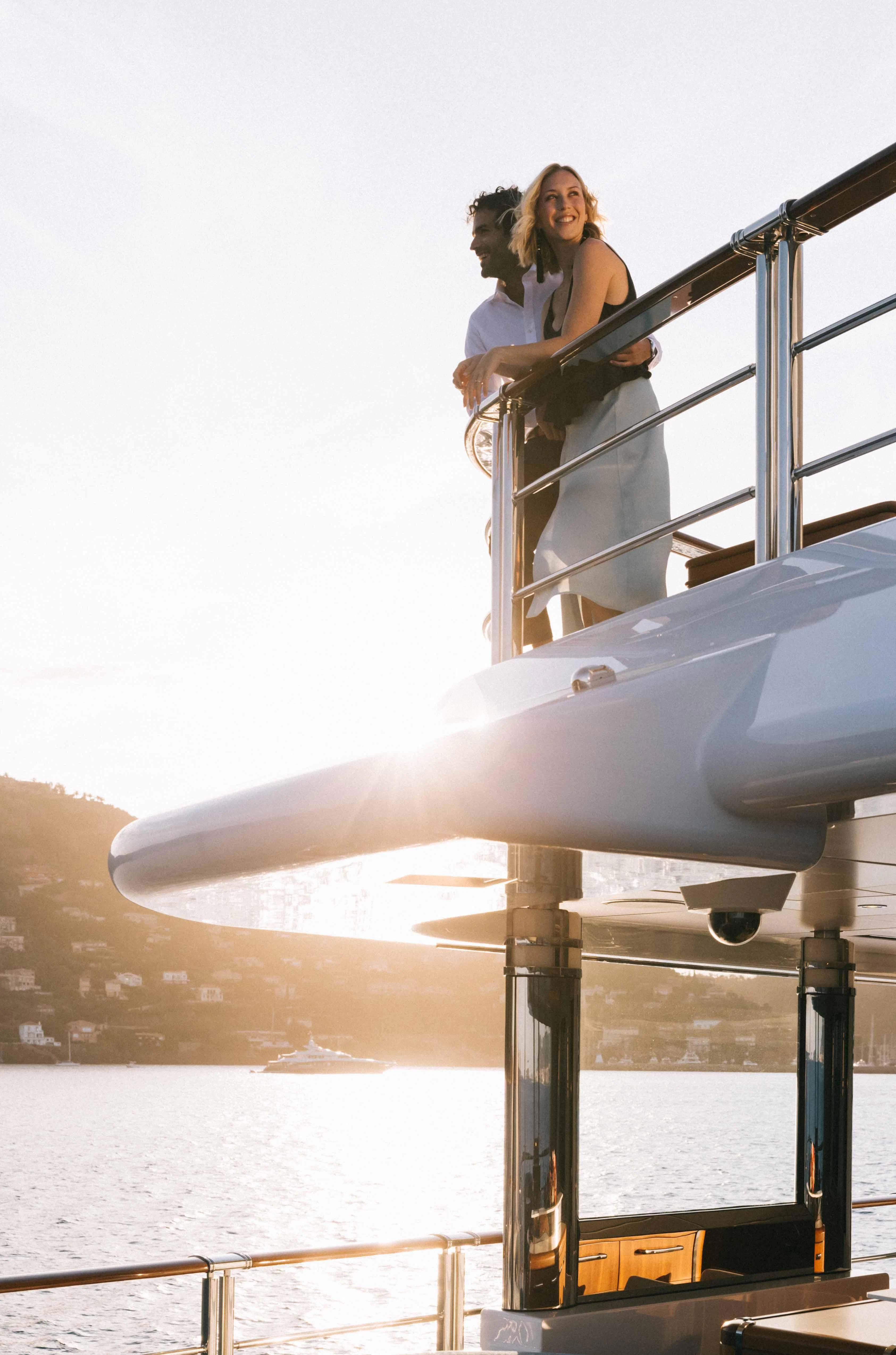 two people standing on a large submarine aboard WHEELS Yacht for Sale