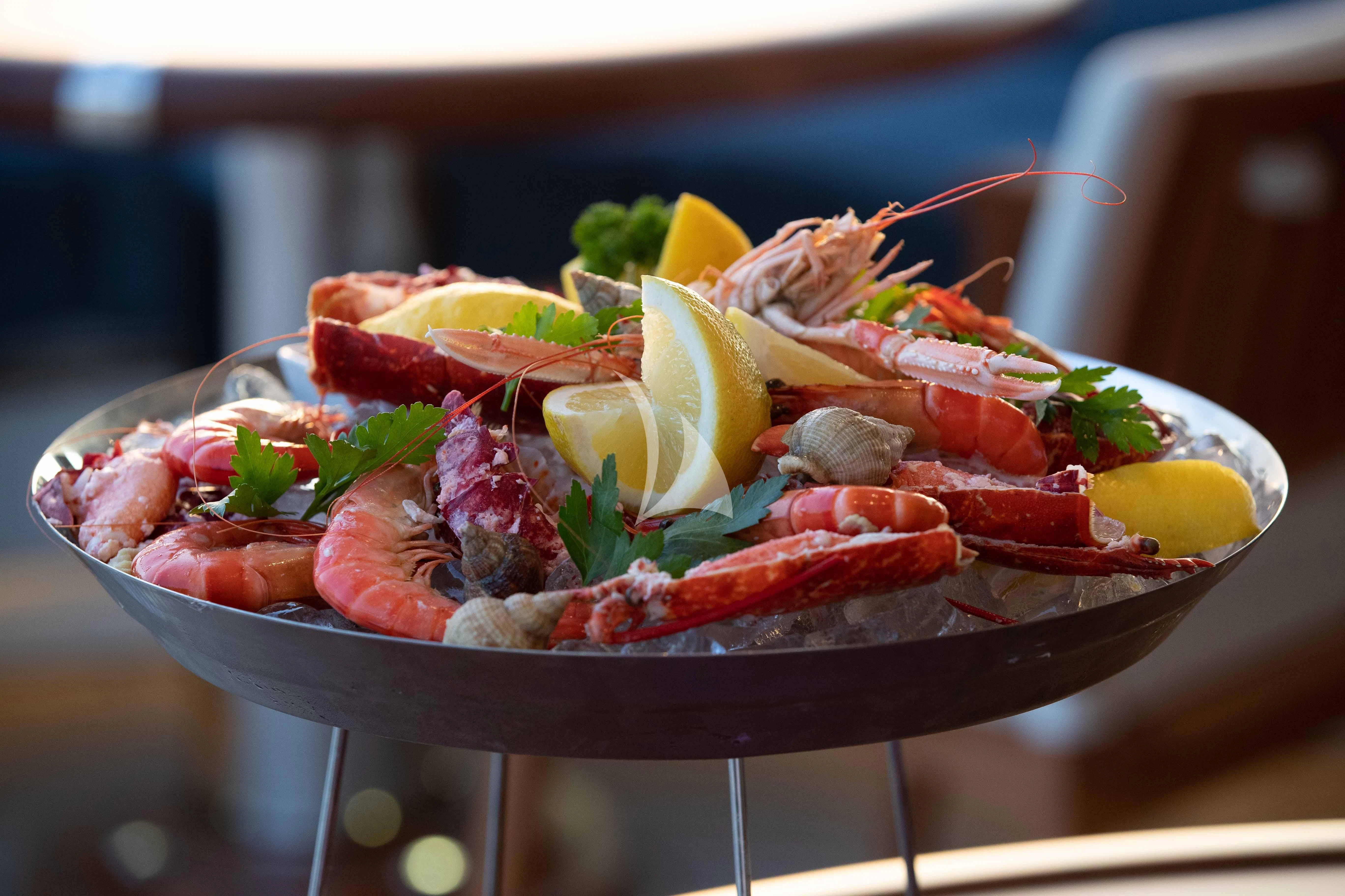 a plate of food aboard WHEELS Yacht for Sale