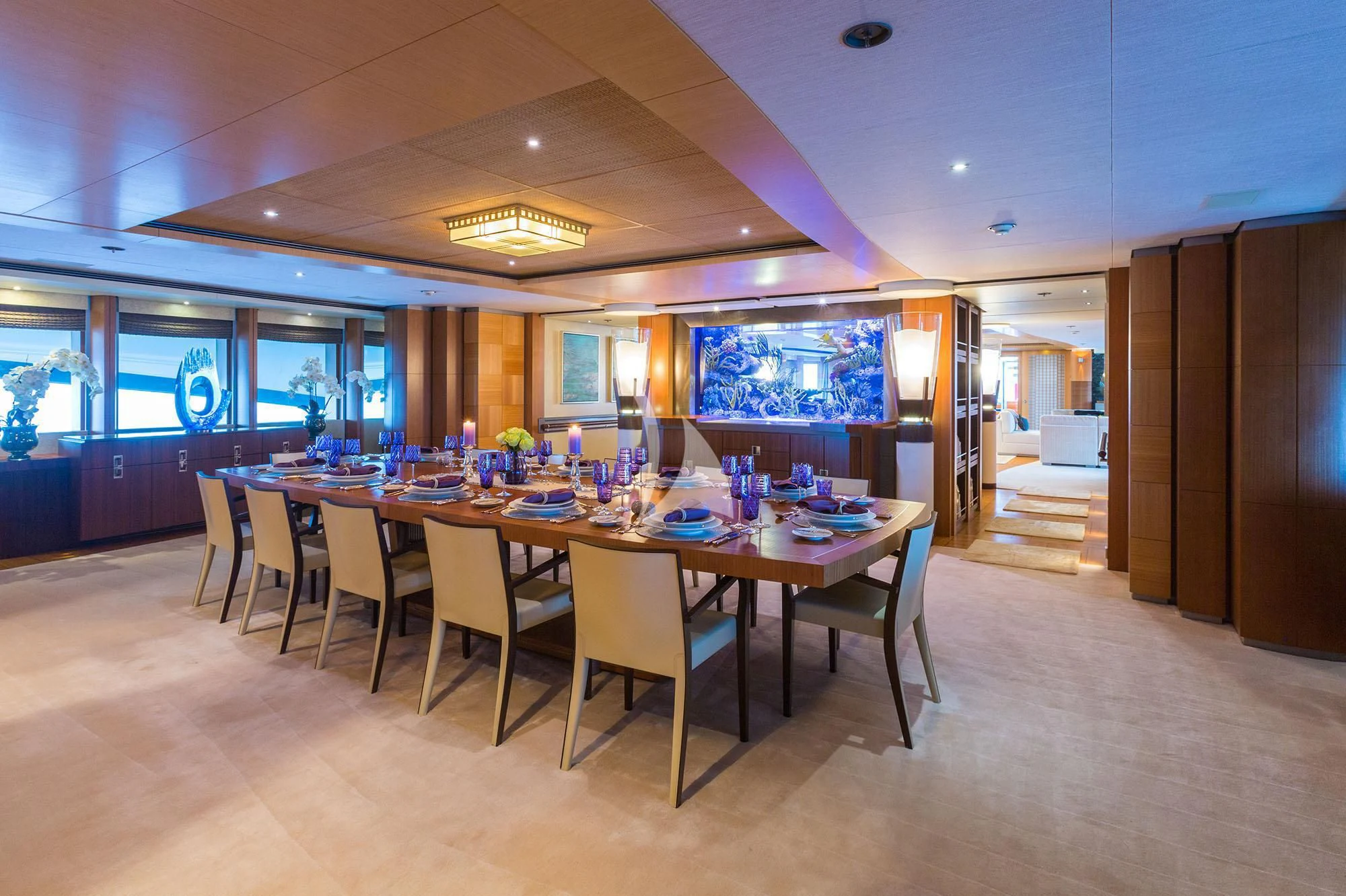 a large dining room with a table and chairs aboard WHEELS Yacht for Sale