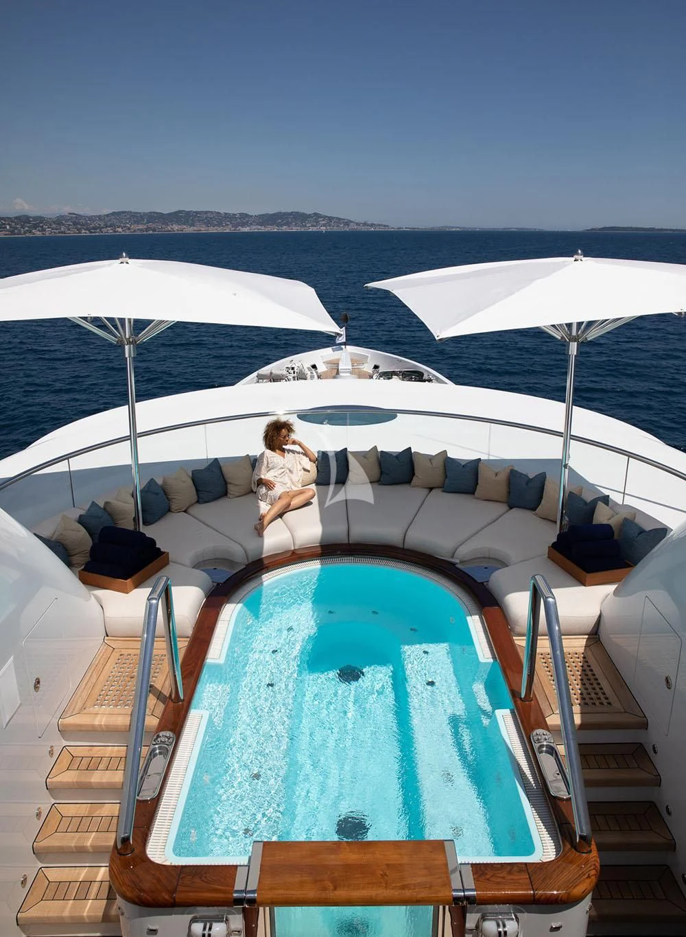 a person sitting on a boat aboard WHEELS Yacht for Sale