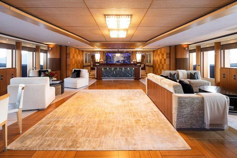 a large living room with a large wood floor aboard WHEELS Yacht for Sale