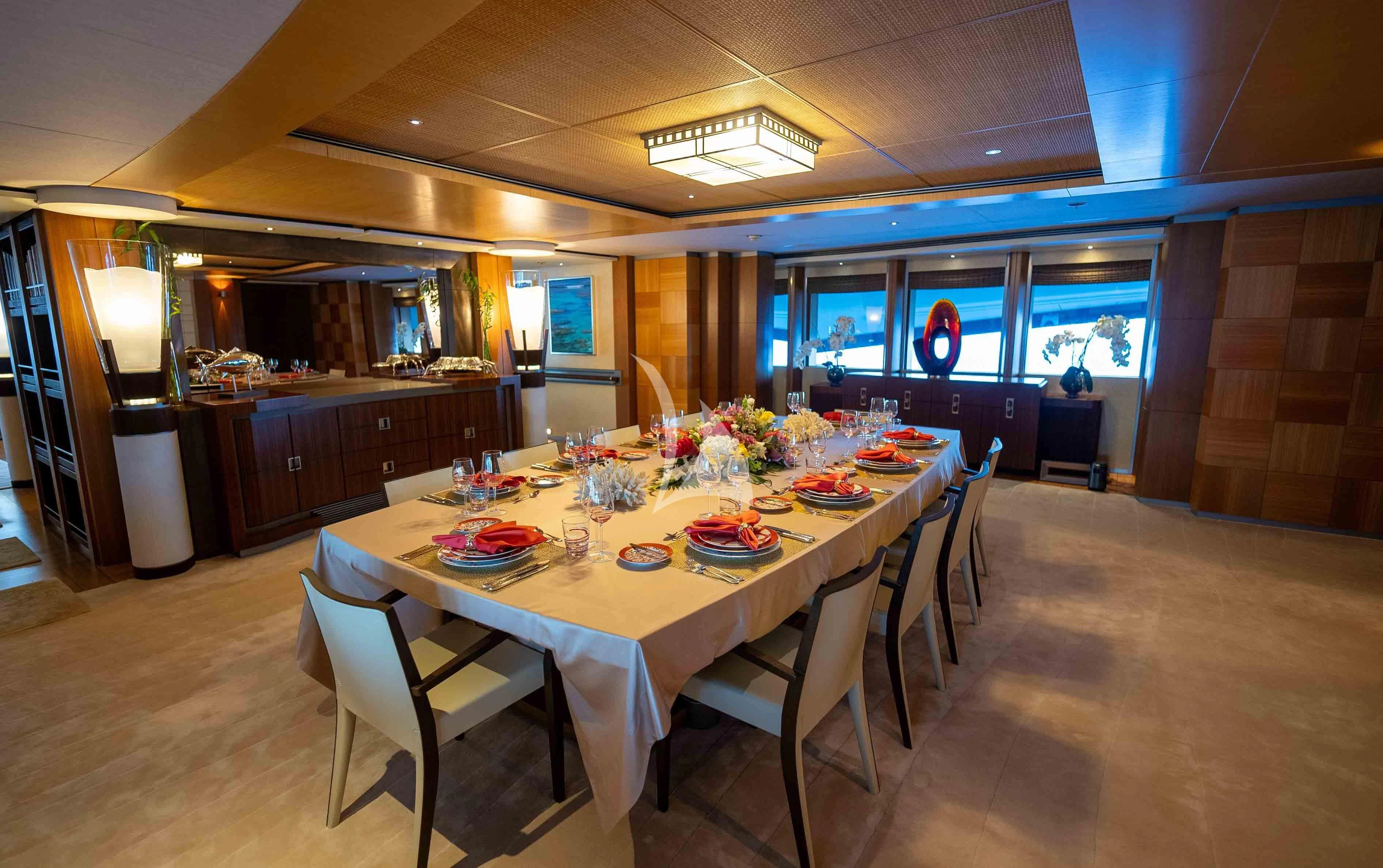 a dining room with a table set aboard WHEELS Yacht for Sale