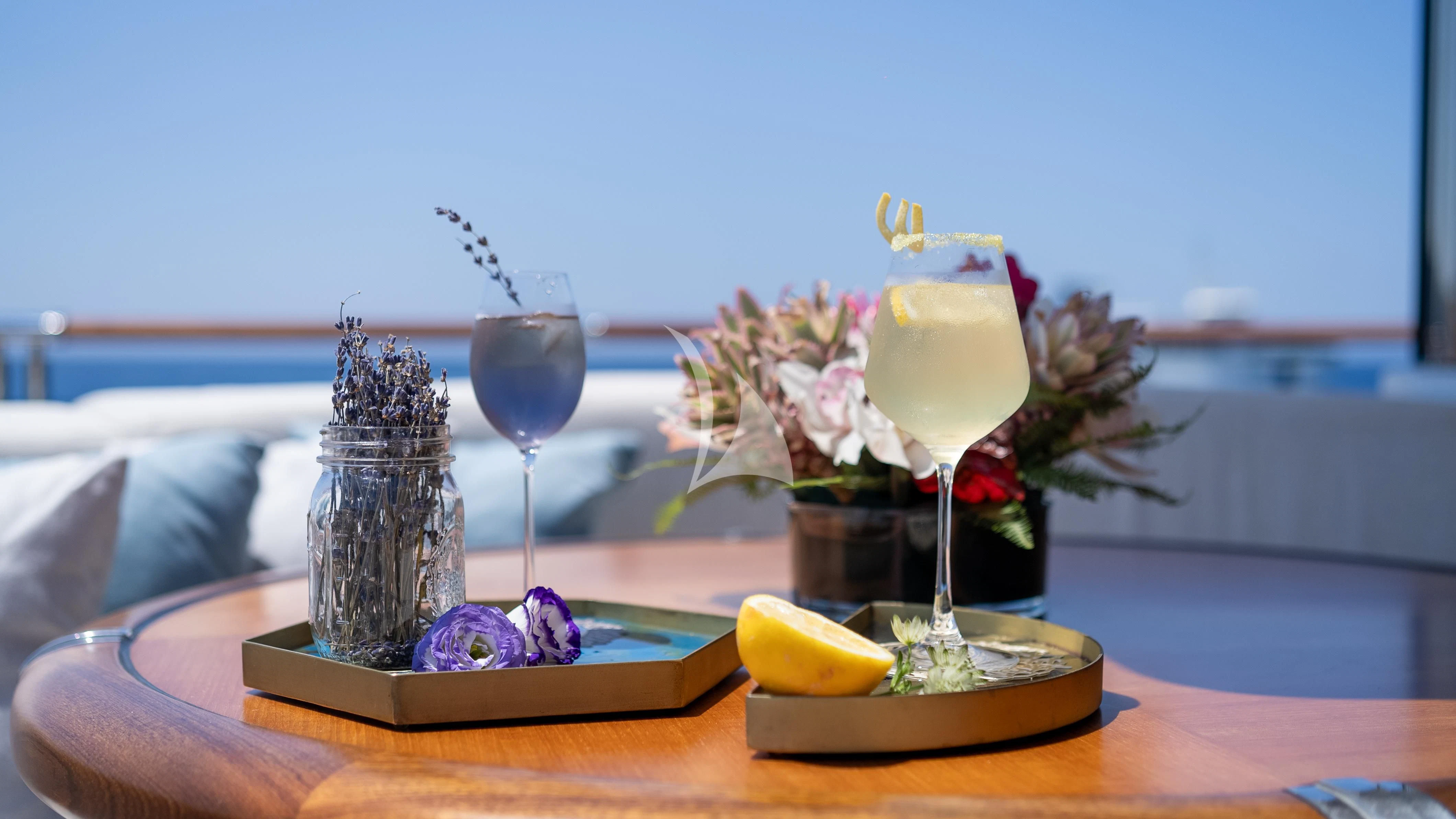 a table with food and drinks aboard WHEELS Yacht for Sale