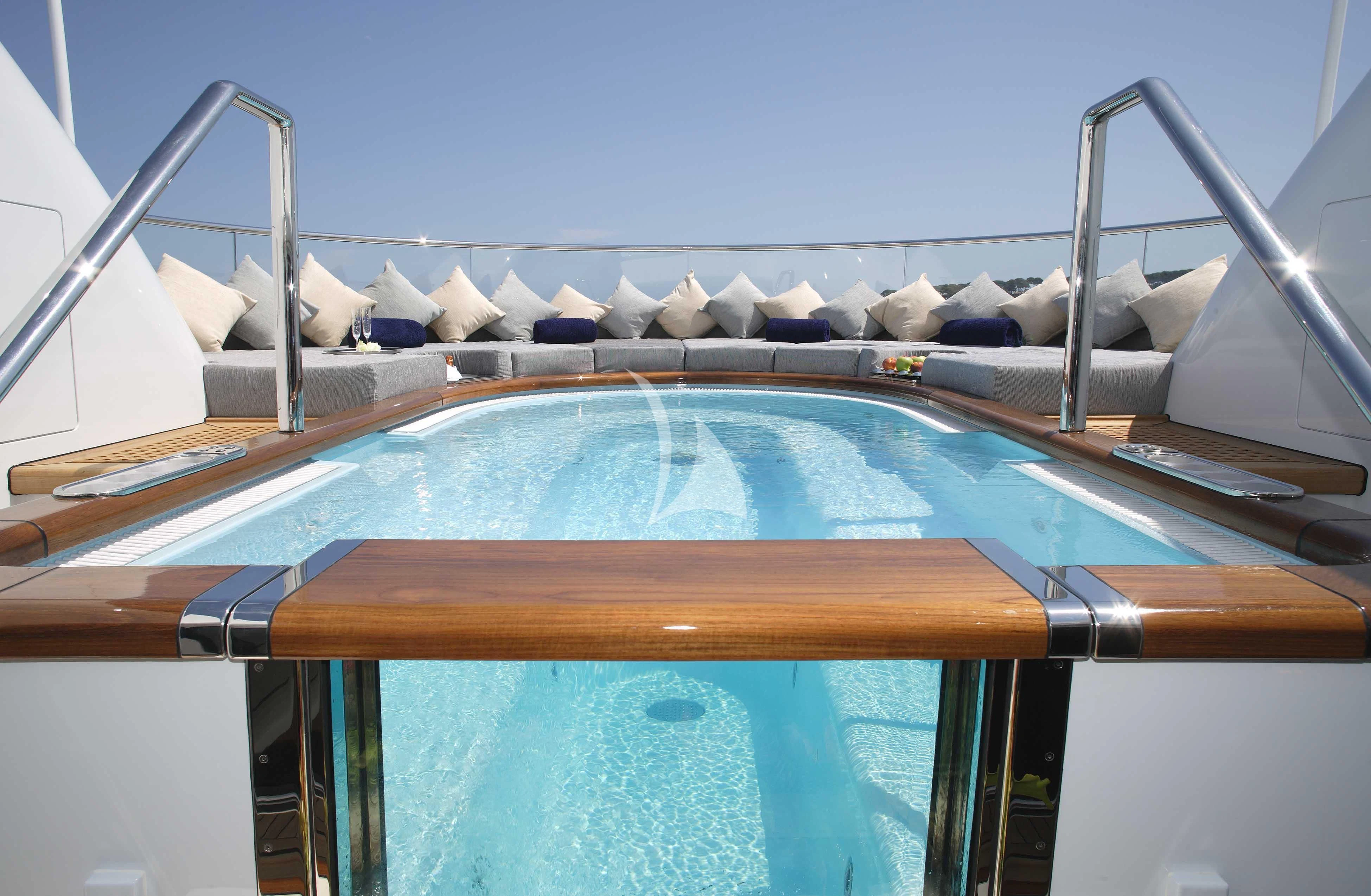 a pool with a railing aboard WHEELS Yacht for Sale