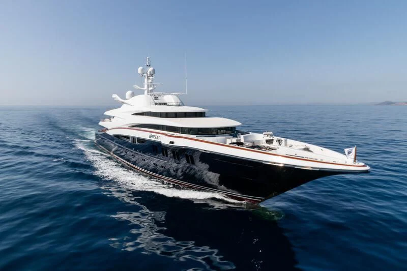 a large white boat in the water aboard WHEELS Yacht for Sale