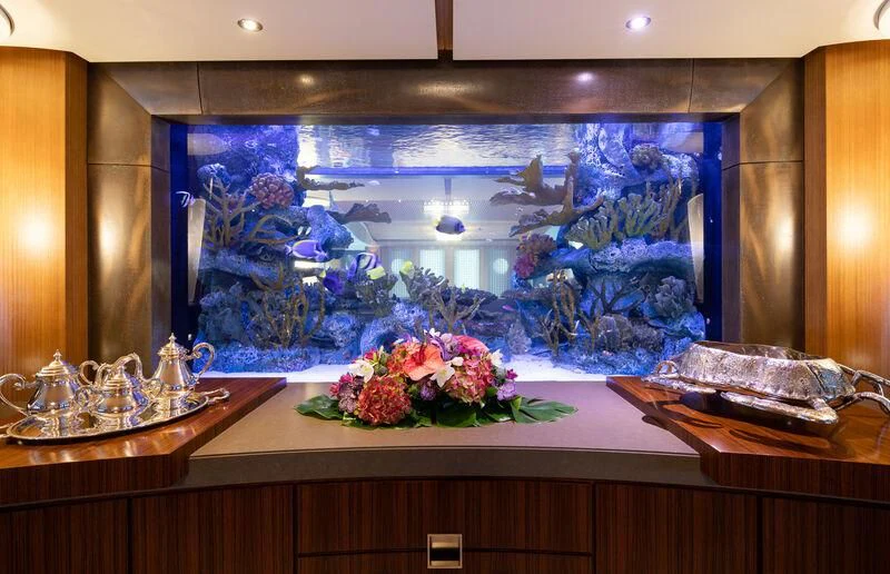 a fish tank with fish and flowers aboard WHEELS Yacht for Sale