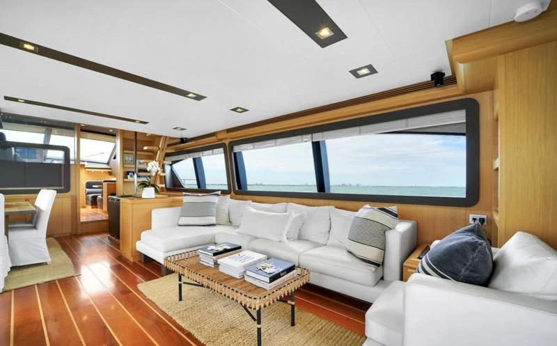 a living room with a large window aboard BON BON Yacht for Sale