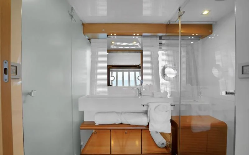 a bathroom with a sink and a mirror aboard BON BON Yacht for Sale