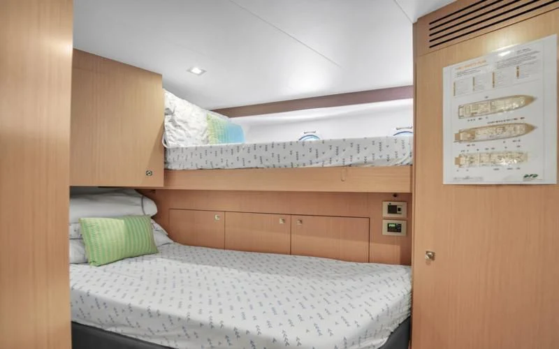 a room with a bed and a desk aboard BON BON Yacht for Sale