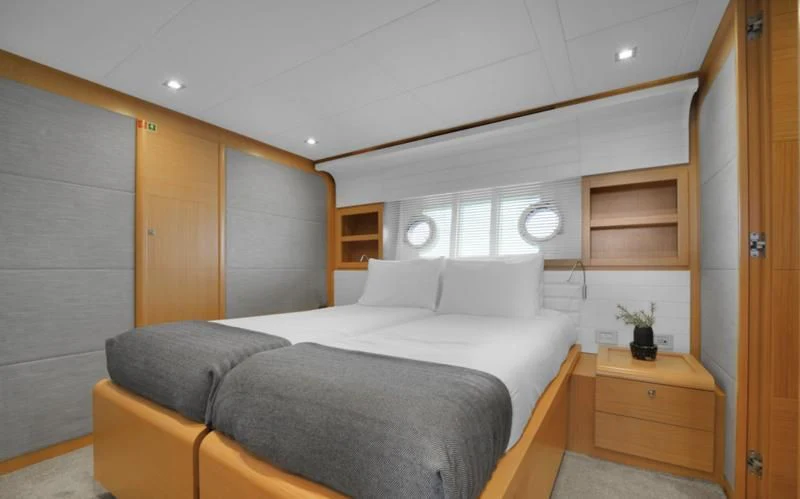 a bed in a room aboard BON BON Yacht for Sale