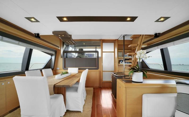 a room with a table and chairs aboard BON BON Yacht for Sale