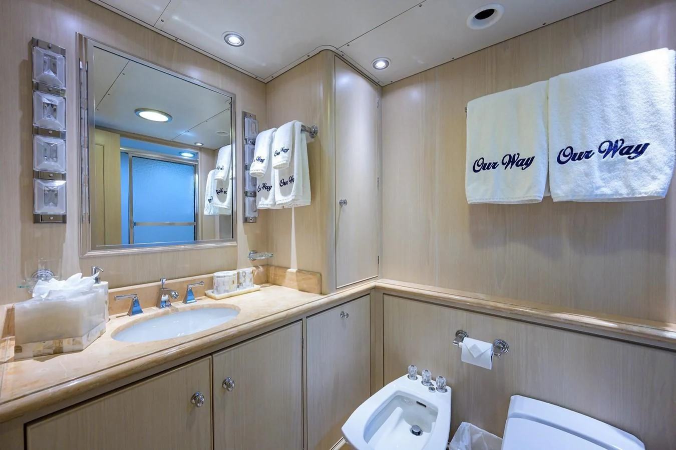 a bathroom with a mirror and a sink aboard OUR WAY Yacht for Sale