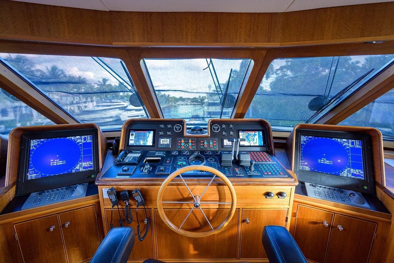 a wooden desk with computers and monitors aboard OUR WAY Yacht for Sale