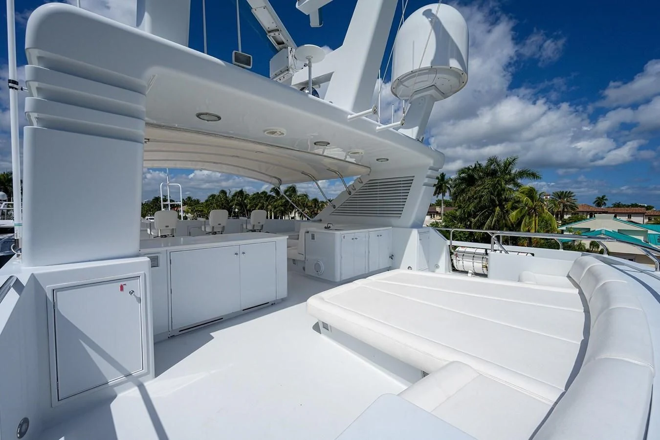 a large white building with a pool aboard OUR WAY Yacht for Sale
