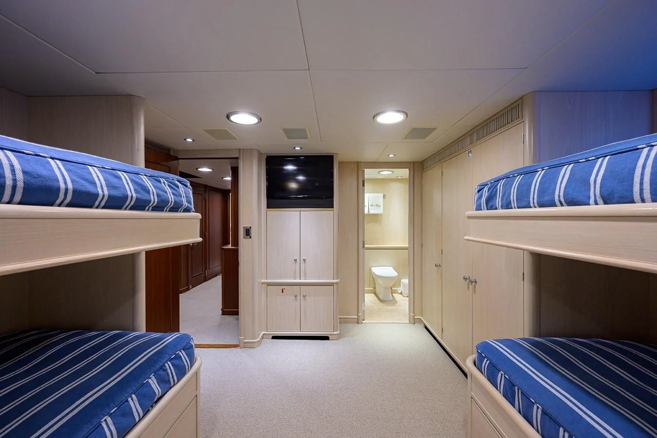 a room with beds and a tv aboard OUR WAY Yacht for Sale
