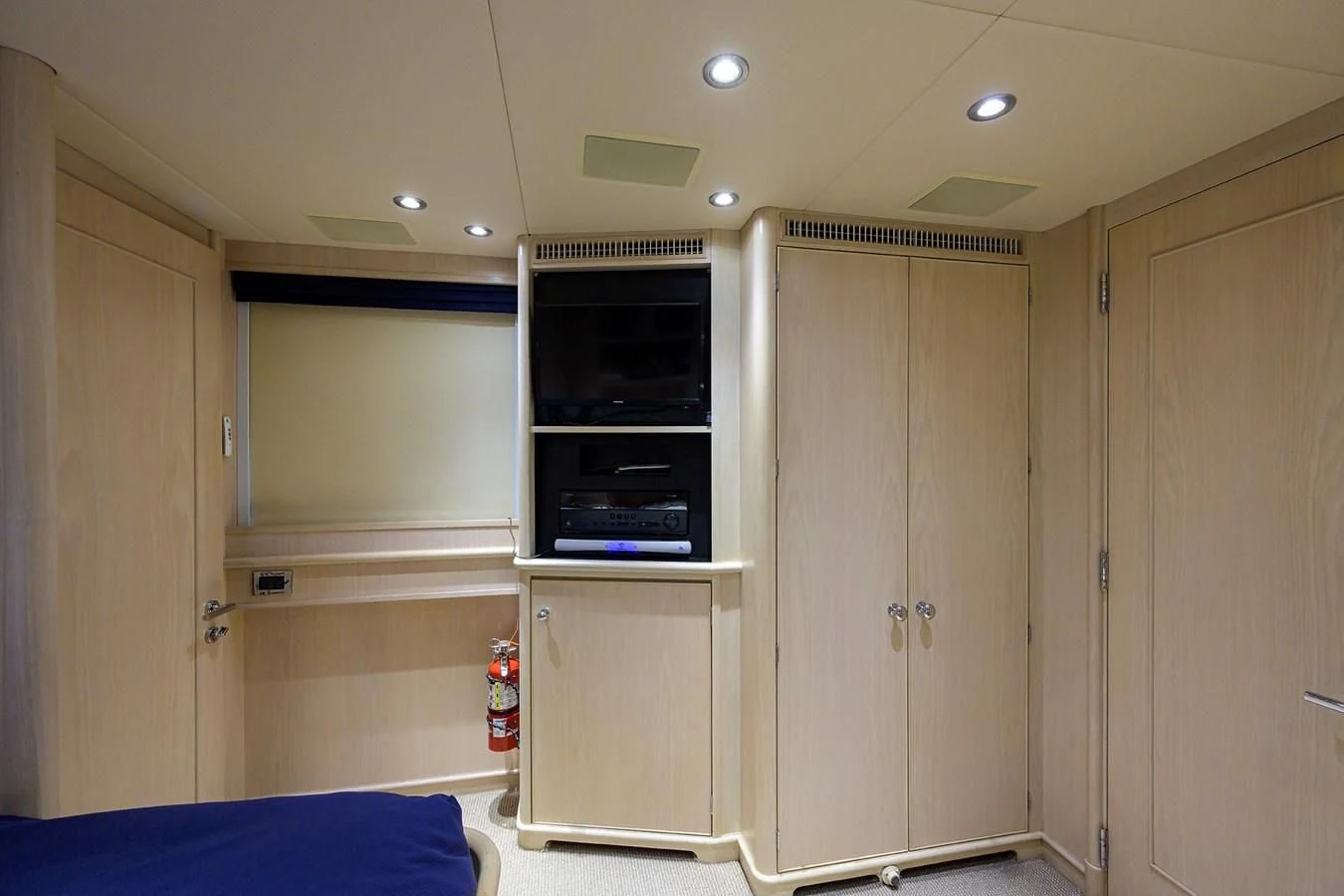 a room with a television and a closet aboard OUR WAY Yacht for Sale
