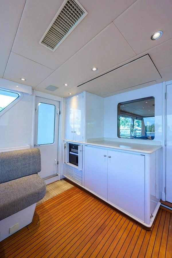 a living room with a couch and a television aboard OUR WAY Yacht for Sale
