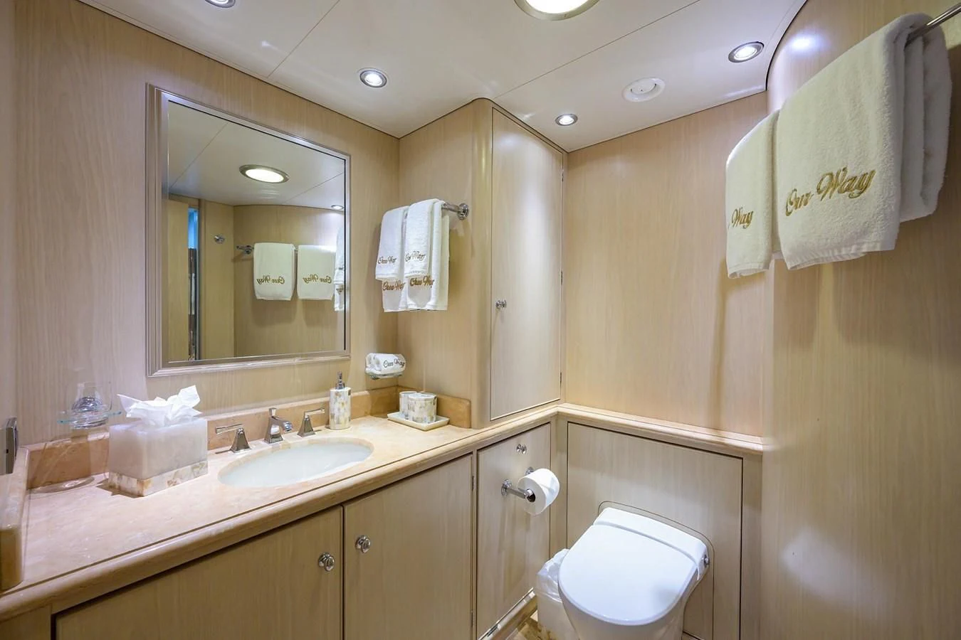 a bathroom with a sink and a mirror aboard OUR WAY Yacht for Sale