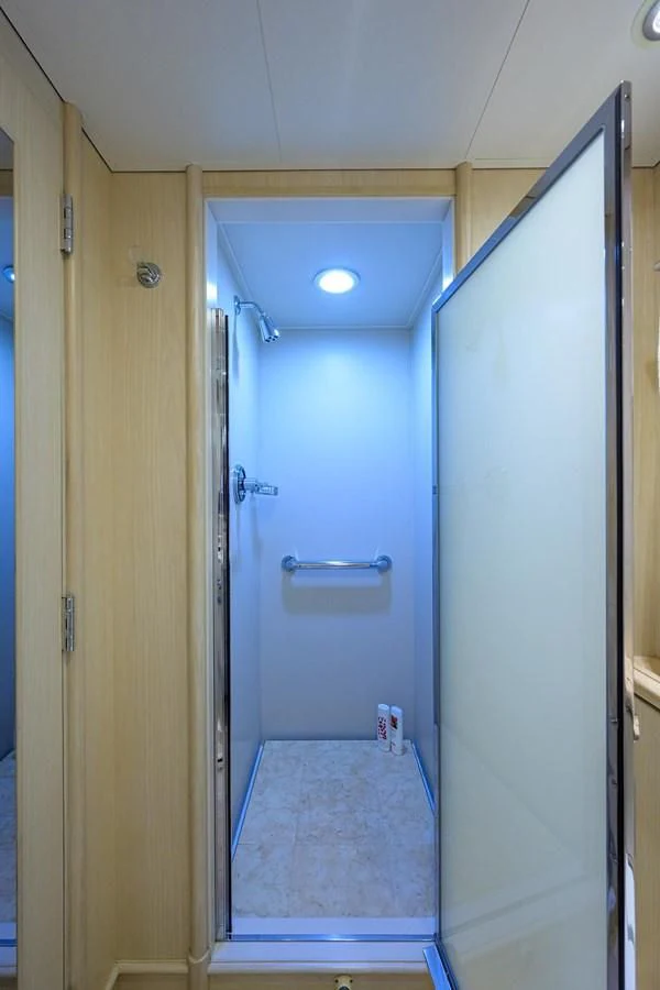 a bathroom with a blue door aboard OUR WAY Yacht for Sale