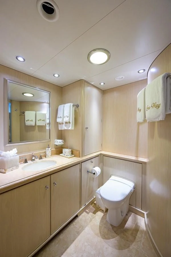 a bathroom with a toilet and sink aboard OUR WAY Yacht for Sale